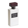 A white perfume bottle with a dark red cap and a label that reads "Baklava Pearlescent Parfums Extrait de Parfum.