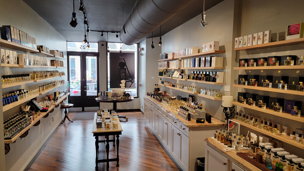 A wide shot of a perfume shop fully stocked