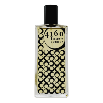 A rectangular glass perfume bottle labeled "4160Tuesdays," with a pattern of black circles on the lower part, exudes an essence reminiscent of cedarwood.