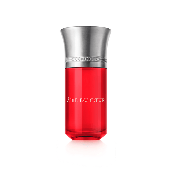 A red perfume bottle with a silver cap and embossed trim, labeled "Ame Du Coeur" by Liquides Imaginaires, captures the essence of love and heartfelt emotions.