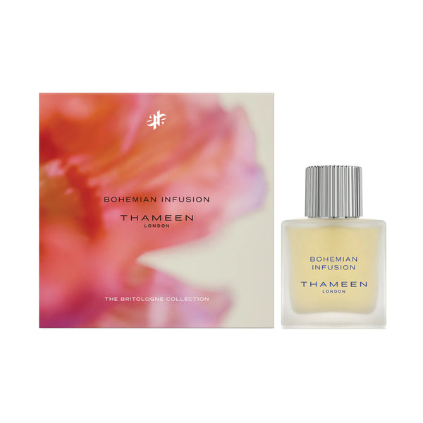 A perfume bottle labeled "Bohemian Infusion, THAMEEN" stands next to a colorful, partially blurred box with the same text and logo. The fragrance contrasts beautifully within its elegant packaging, capturing the essence of Maurice Roucel's artistry.