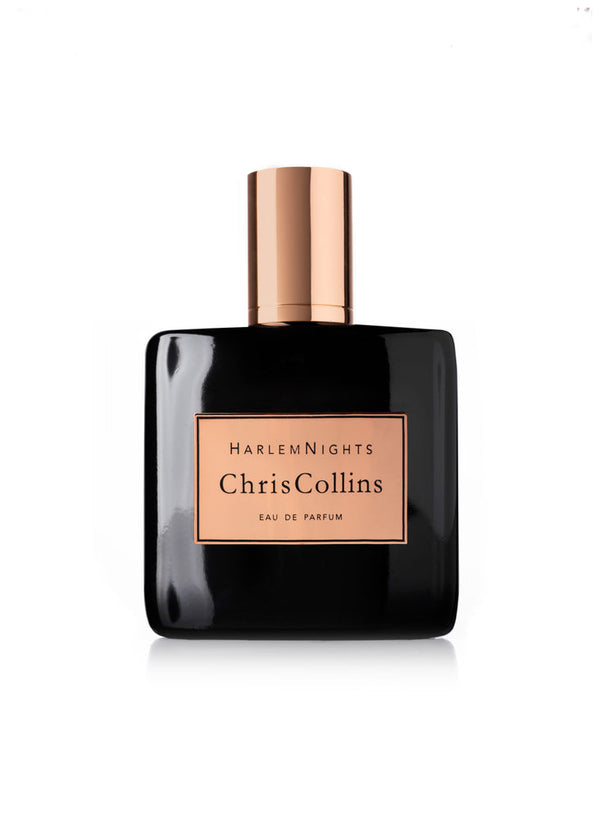 A bottle of Harlem Nights by Chris Collins Eau de Parfum, featuring a sleek black design with an elegant gold cap and label, is showcased against a white background, emanating an aura of evening scent seduction.