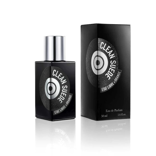 A 50ml bottle of État Libre d'Orange's Clean Suede Eau de Parfum, evoking the scent of a fresh leather jacket, is showcased next to its sleek black packaging box.