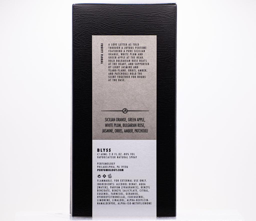 The back of a perfume box showcasing "Blyss" with an ingredients list, fragrance notes, usage instructions, and the product's sizing information (6 fl. oz./185 mL). The Blyss fragrance, crafted through Perfumology using high quality ingredients, promises a sublime olfactory experience.