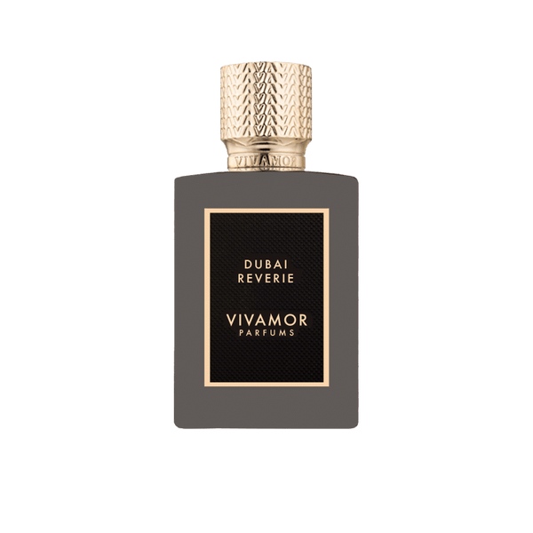 A rectangular perfume bottle labeled "Dubai Reverie VIVAMOR Parfums" with a textured gold cap. The bottle is dark with a black and gold label, hinting at notes of Madagascan Vanilla Cream.