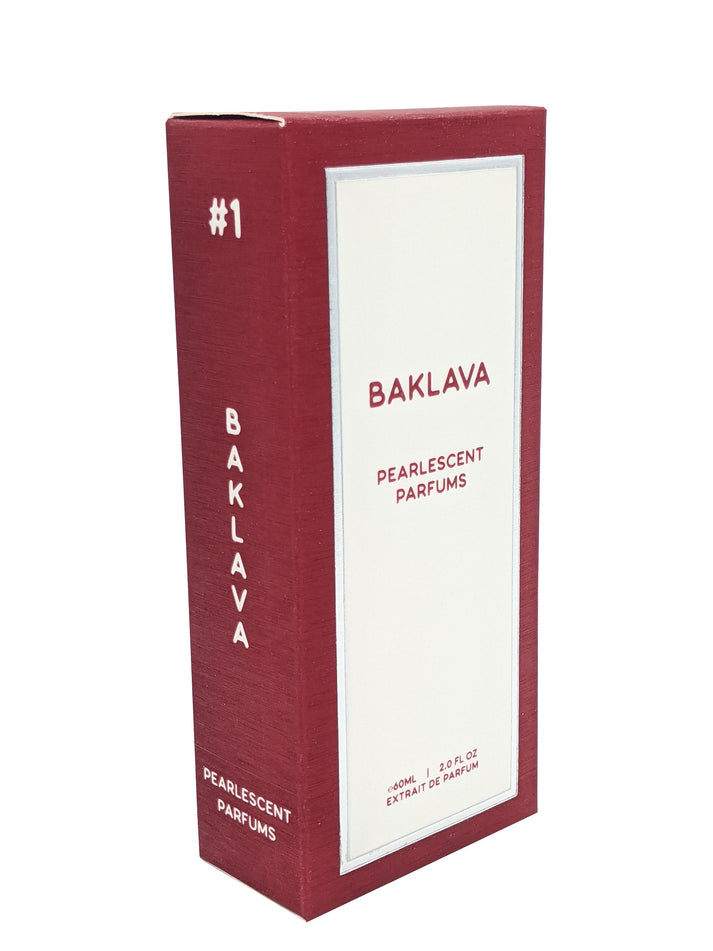 A maroon box labeled "Baklava Pearlescent Parfums #1," containing 60 mL (2.0 fl. oz) of extrait de parfum, with notes of sweet orange.