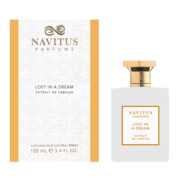 A 100 ml bottle of Navitus Parfums' Lost in a Dream extrait de parfum with a gold cap, displayed alongside its matching white and gold box. This dreamy fragrance, crafted by a master perfumer, offers a unique sillage that leaves an unforgettable impression.