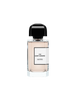 A clear glass perfume bottle with a black cap labeled "312 Saint-Honoré" by BDK Parfums and containing a light pink liquid, reminiscent of orange blossom.