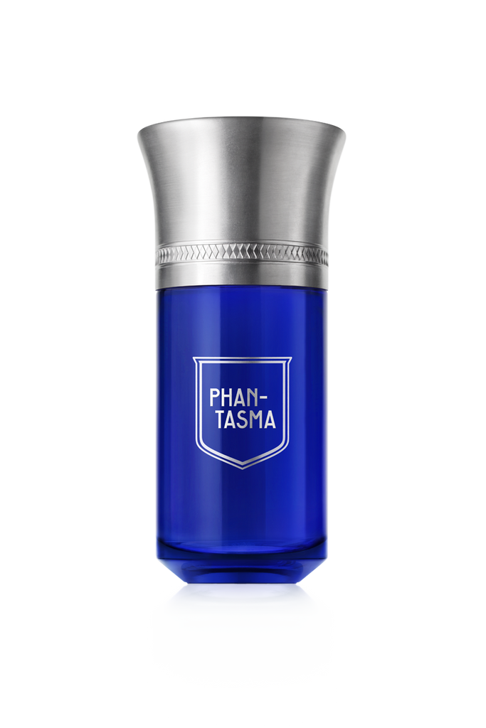 A blue bottle of Phan-Tasma perfume by Liquides Imaginaires, featuring a silver cap and engraved detailing, infused with the essence of sensual wood.