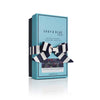A teal box of Shay and Blue, adorned with a black and white striped ribbon bow, houses the oriental floral essence. The label reads "Black Tulip" with subtle notes of white chocolate.