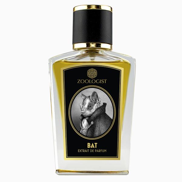 A bottle of Zoologist Bat, featuring a black and white illustration of a bat wearing a suit on the label. This fruity tropical perfume comes in a bottle with a black cap and gold accents, capturing the essence of its cavernous home.