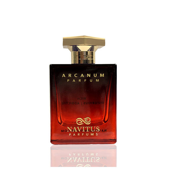 A bottle of Navitus Parfums' Arcanum with a hexagonal gold cap and a gradient from dark red to lighter red on the bottle, evoking rich dark amberwoods and hints of cinnamon spice.