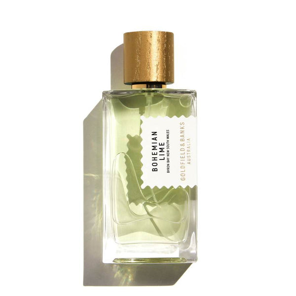 A bottle of Bohemian Lime fragrance by Goldfield & Banks, with green liquid inside and a gold cap. The label displays the brand and fragrance name in black text. Infused with Australian finger lime, this tropical fragrance captures the essence of sun-kissed adventures.