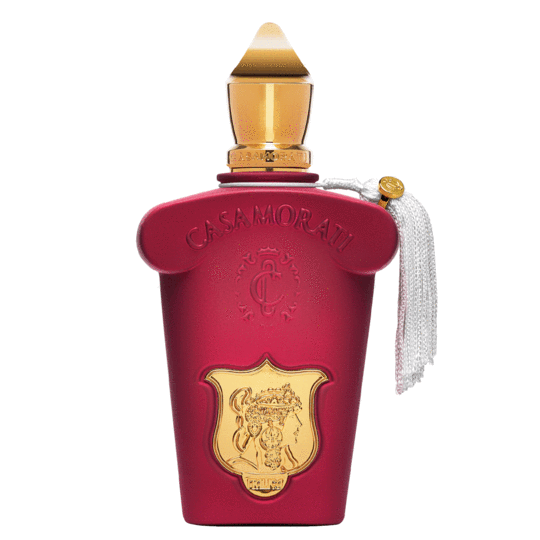 A maroon perfume bottle with gold accents, labeled "Casamorati Italica," exudes elegance. It features an intricate gold emblem, a gold-tipped cap, and a white tassel attached to the side. The gourmand perfume hints at sandalwood, giving it a luxurious finish.