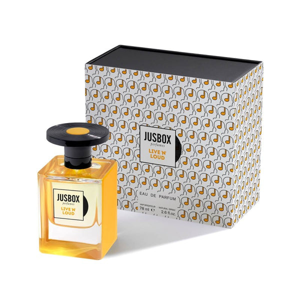 A Jusbox "Live 'N' Loud" perfume bottle is placed adjacent to its matching box, which showcases a patterned design adorned with small musical notes, capturing the spirit of music and mental well-being.