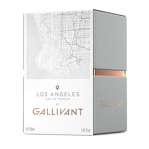 A white and light gray perfume box labeled "Los Angeles by Gallivant by Gallivant Perfumes" featuring a map design. The packaging includes a gray bottle with a copper accent, evoking the sultry woody floral essence within. Volume is indicated as 30 ml or 1.01 FL oz.