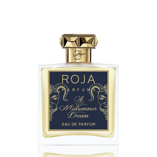 A bottle of Roja Parfums "A Midsummer Dream EDP" with a gold cap and a navy label featuring gold detailing, infused with hints of rose.