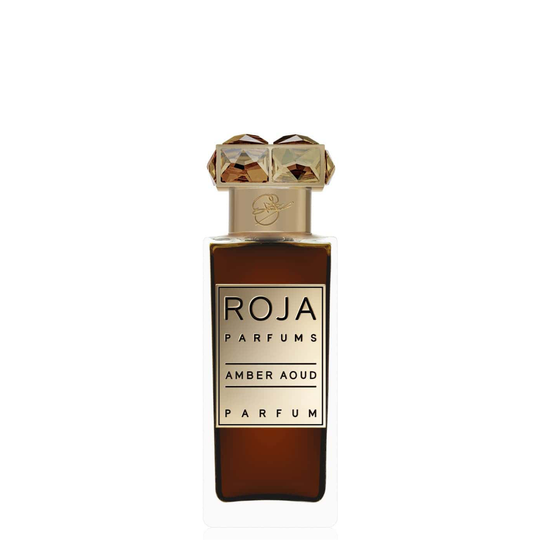 A bottle of Roja Amber Aoud with a gold label and an intricately designed gold cap, exuding a sensual blend that epitomizes an oriental fragrance.