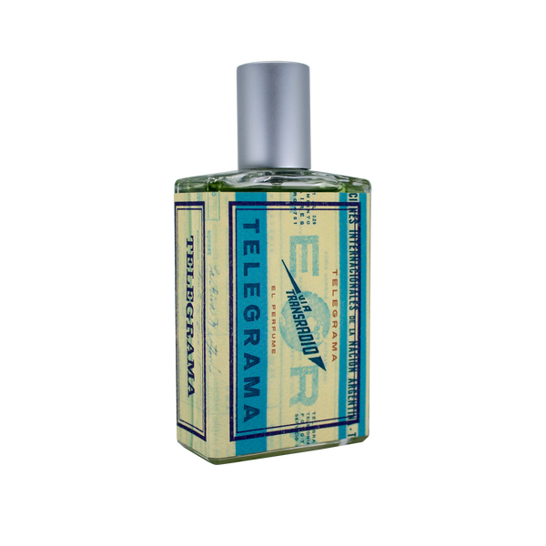 A bottle of perfume labeled "Telegrama" by Imaginary Authors with a blue and cream color scheme, a silver cap, and the plush scent reminiscent of a vintage first-class experience.