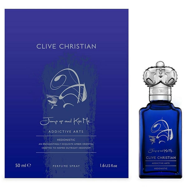 Clive Christian's Jump up and Kiss Me Hedonistic perfume spray (50 ml) in a blue bottle with an ornate silver cap, displayed next to its blue packaging box. The text on the box reads "Jump up and Kiss Me.