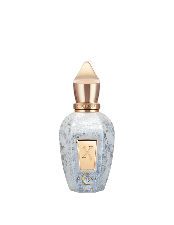 A decorative perfume bottle with a gold cap and accents, featuring a frosted white and silver textured surface reminiscent of the moon landing, and a gold label with embossed details—Apollonia by Xerjoff.