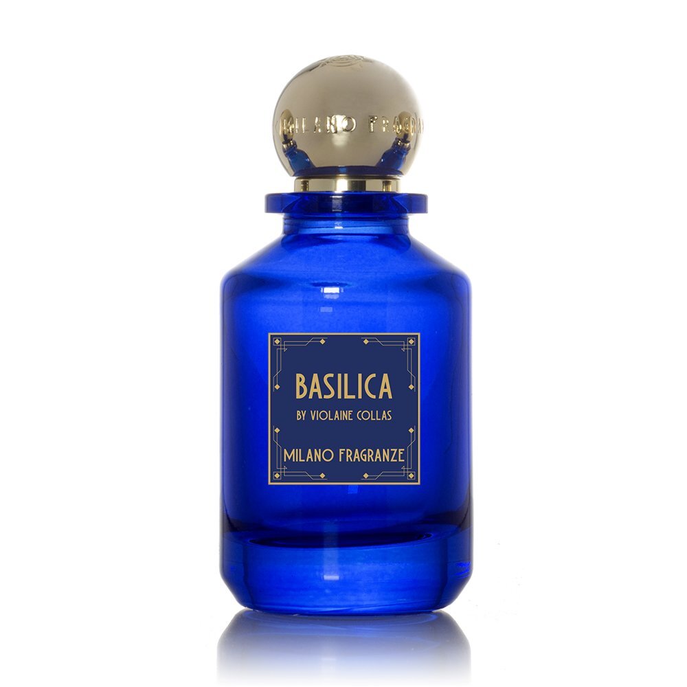 A blue glass bottle of Basilica by Milano Fragranze, with a gold cap and a gold-accented label, exuding scents reminiscent of soothing incense.