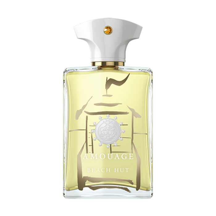 A bottle of Amouage Beach Hut Man fragrance with a white cap and gold accents. The bottle contains light yellow liquid and has decorative elements on the front, offering an olfactive escape that embodies the essence of freedom.