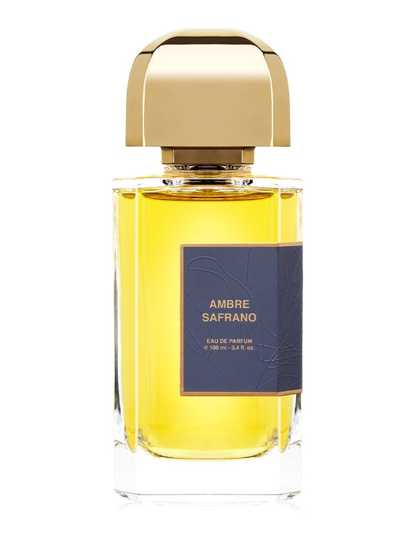 A bottle of BDK Parfums Ambre Safrano eau de parfum with a gold cap and a label indicating 100 ml (3.4 fl oz). This exquisite oriental fragrance is infused with saffron, enveloping you in its luxurious scent.