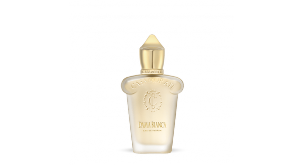 A frosted glass perfume bottle with a golden cap. The label reads "Casamorati" and "Dama Bianca, Eau de Parfum," evoking the essence of a vintage scent from an Italian perfumery.