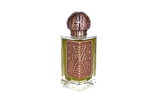 A uniquely designed perfume bottle with a bronze spherical cap and a patterned label reading "Broken Anatomy Brain Dance Eau de Parfum." The bottle contains a light green liquid, evoking refreshing fragrance notes in this aquatic perfume.