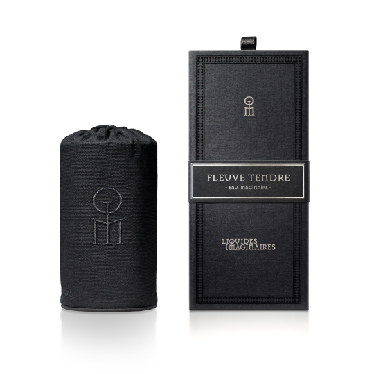A cylindrical black bottle cover and a matching rectangular box, both adorned with the text "Fleuve Tendre" and "Liquides Imaginaires," feature minimalistic white designs on a black background that evoke the essence of the Tendre River, perfectly capturing Sonia Constant's inspired perfume vision.