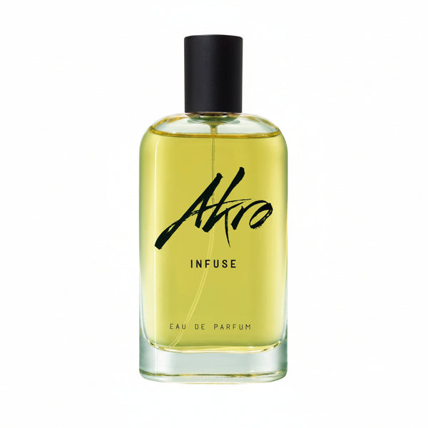 A glass bottle of Akro INFUSE Eau de Parfum, featuring a black cap and filled with yellow liquid, stands against a white background, perfectly embodying the sophisticated notes beloved by tea connoisseurs and inspired by the nuanced flavors of Asian tea culture.