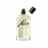 A clear glass bottle of INK by Akro Eau de Parfum featuring a black spray nozzle, with its detached black cap placed to the side, capturing the essence of its unique tattoo fragrance.