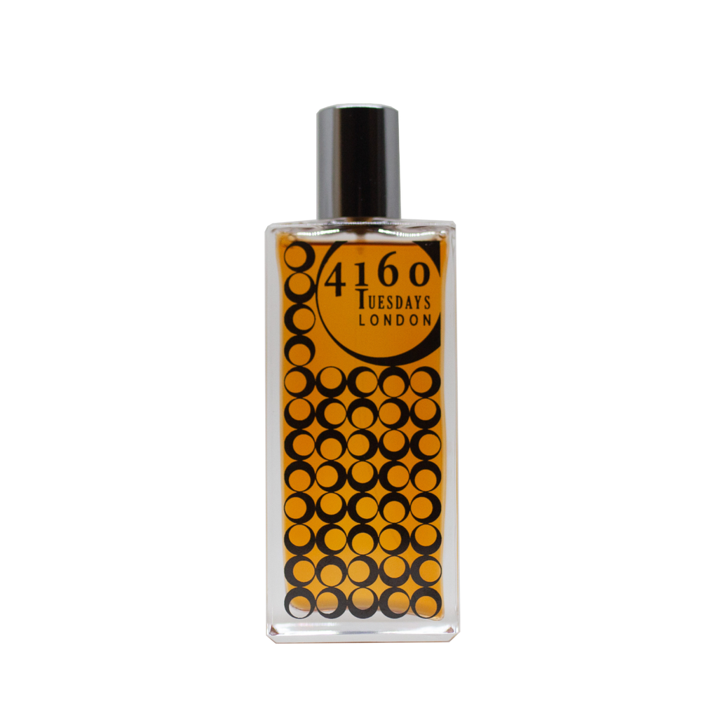 A rectangular glass bottle with a black cap, containing a yellow-orange liquid. The label reads "4160Tuesdays" and depicts a pattern of black circles over an orange background. The scent is named "Salt Rose" and evokes the essence of wild roses blooming near the Greater Thames Estuary.