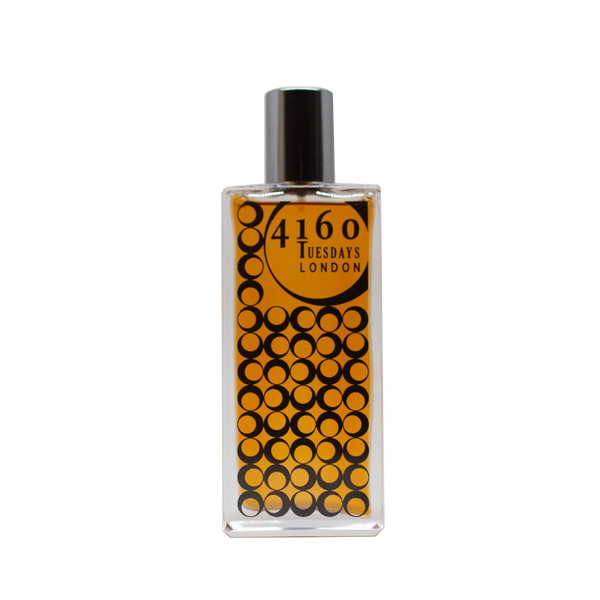 A rectangular glass bottle with a black cap, containing a yellow-orange liquid. The label reads "4160Tuesdays" and depicts a pattern of black circles over an orange background. The scent is named "Salt Rose" and evokes the essence of wild roses blooming near the Greater Thames Estuary.