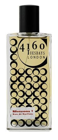 A perfume bottle labeled "4160Tuesdays" with a black and white circular pattern, featuring the name "Shazam!" at the bottom, exudes a burst of spicy amber.