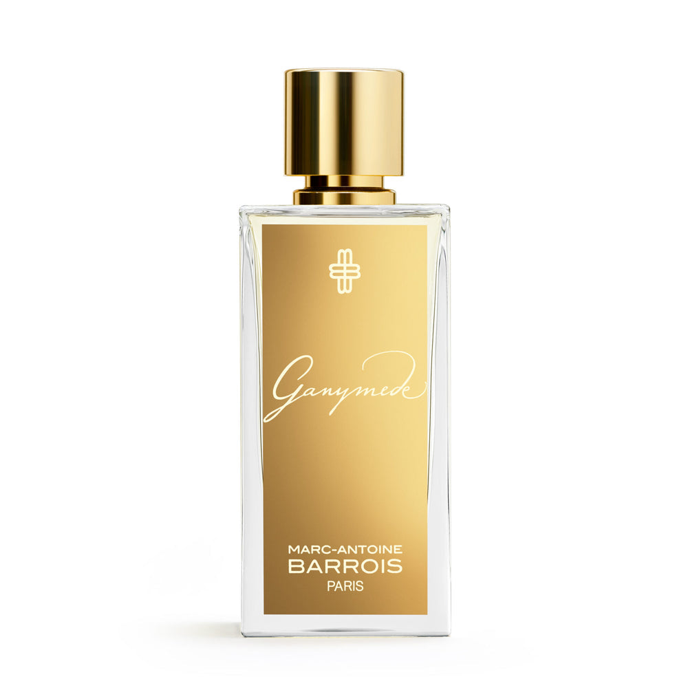 A bottle of Marc-Antoine Barrois Ganymede perfume, adorned with a gold label and topped with a matching gold cap.