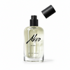 A clear glass bottle labeled "Akro NIGHT Eau de Parfum" with a black spray nozzle and a detached black cap, featuring musky notes and the essence of Bulgarian rose.