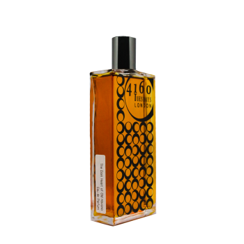 Rectangular glass bottle labeled "4160Tuesdays" with an orange liquid inside and a black cap. The design features black circular patterns, evoking the allure of Old Havana, perfectly embodying the essence of its name: Dark Heart of Old Havana.