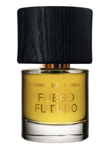A bottle of Thomas De Monaco Fuego Futuro Extrait de Parfum, featuring a black cap and yellow liquid inside, invokes the mystique of shamanic rituals.