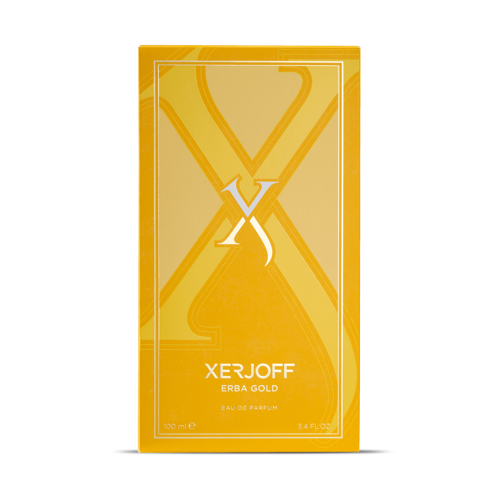 A rectangular, yellow box with "Erba Gold" written on it. The box features a large, stylized letter "X" and contains 100 ml (3.4 fl oz) of eau de parfum with citrusy top notes from the brand Xerjoff.