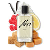 A bottle of Akro BAKE eau de parfum is surrounded by vanilla beans, a swirl of whipped cream, a lemon slice, red sugar candy, brown sugar cubes, and caramel pieces, conjuring the delectable essence of a lemon cupcake gourmand fragrance.