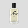 A clear bottle with a black cap contains a pale yellow liquid labeled "BAKE" by Akro in black cursive text on the front, evoking a delectable lemon cupcake fragrance.