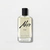 A clear glass bottle of "RISE" by Akro Eau de Parfum, featuring a black cap and bold, black script text on a light background, captures the essence of summer fragrance with hints of Coconut Water and Sandalwood.