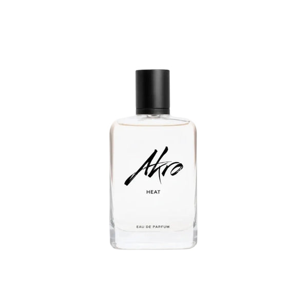 Front view eau de parfum bottle, black cap, clear glass, Ahro Heat label