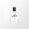 Eau de parfum bottle with black cap and centered Ahro Heat label on clear glass