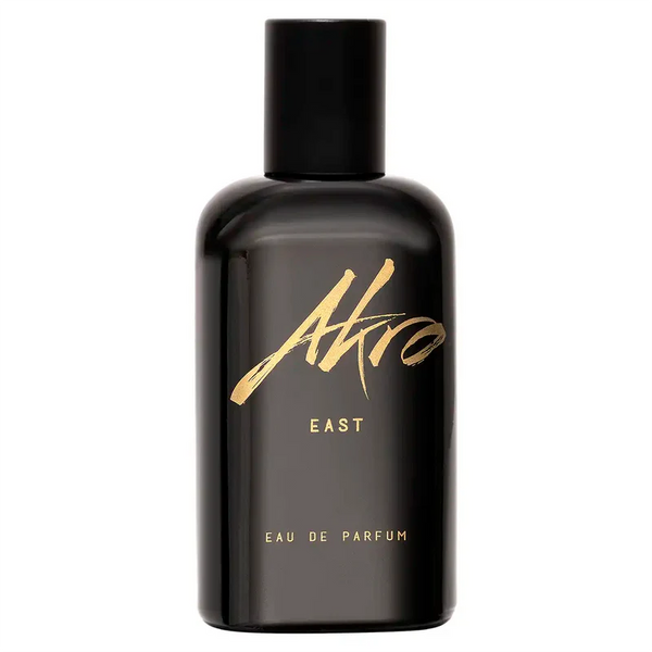 A sleek black bottle of Akro EAST Eau de Parfum, adorned with elegant gold text branding against a pristine white background, encapsulating the mystique of an Oud fragrance inspired by the essence of the Middle East.