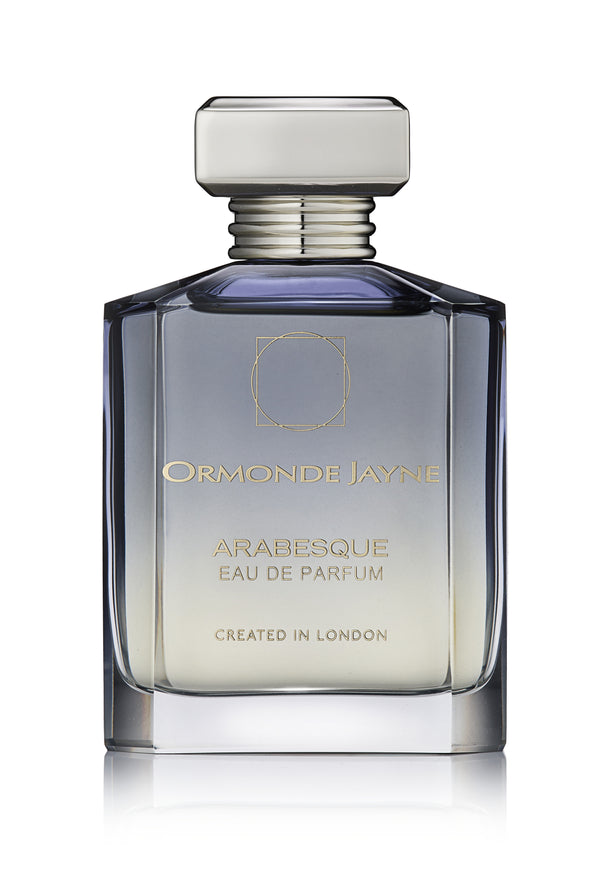 A bottle of Ormonde Jayne Arabesque, with a rectangular cap and gradient glass design, elegantly named "Created in London," this Arabesque perfume captivates with its harmonious blend of rose and jasmine.