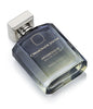 A bottle of Arabesque by Ormonde Jayne with a rectangular shape, dark blue glass, and a silver cap, labeled "Created in London," featuring the captivating scents of rose and jasmine.