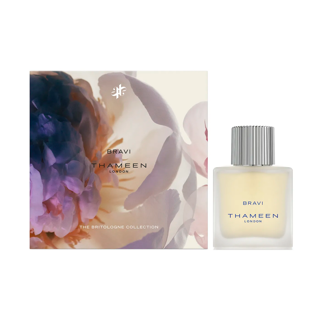 An elegant perfume bottle labeled "Bravi Cologne Elixir THAMEEN" sits beside its floral-themed packaging from "The Britologne Collection," evoking the intoxicating tuberose and mystical allure of the Queen of the Night flower.